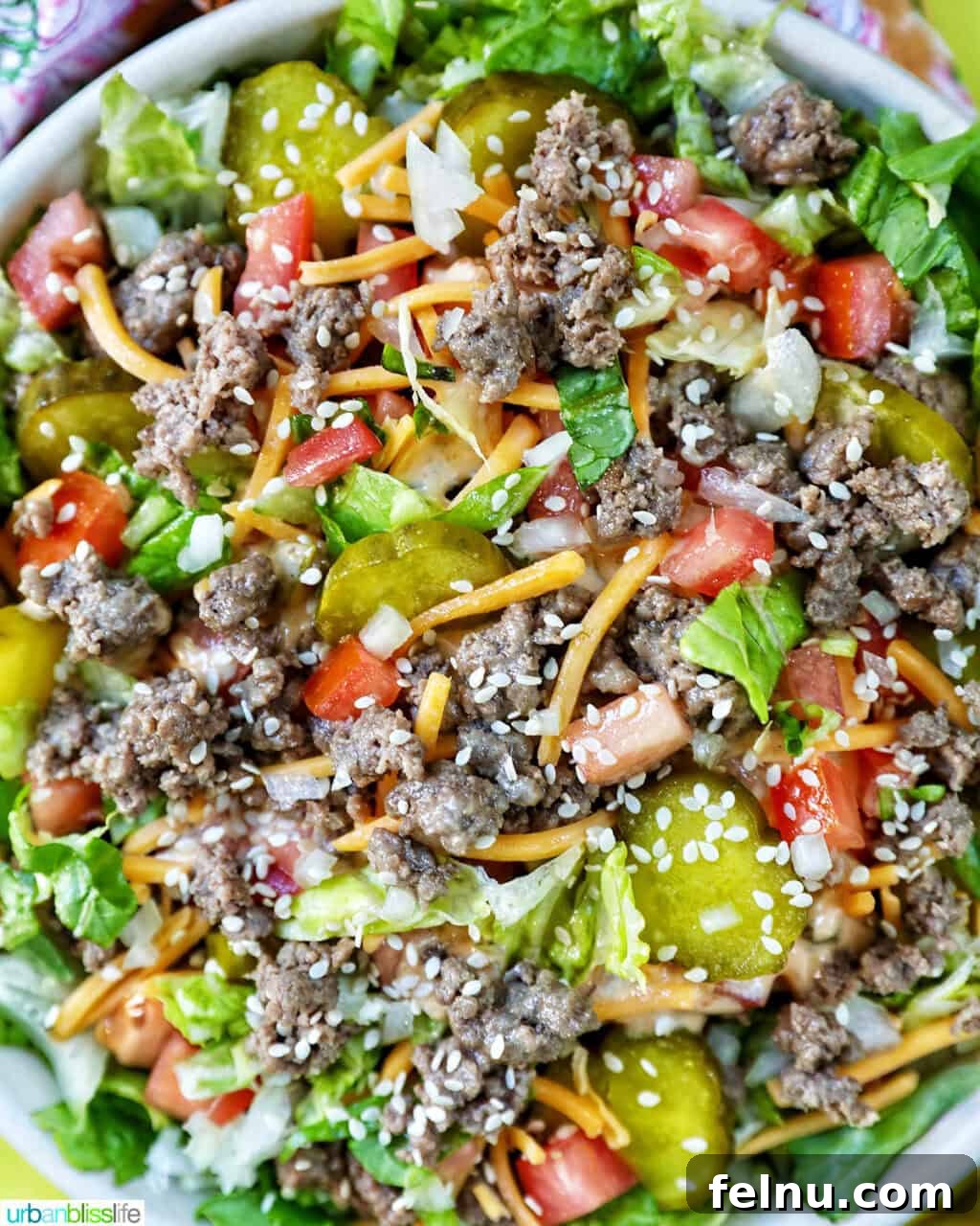 Big Mac Burger Bowl 13 Adding finely diced onions to a Big Mac salad bowl.