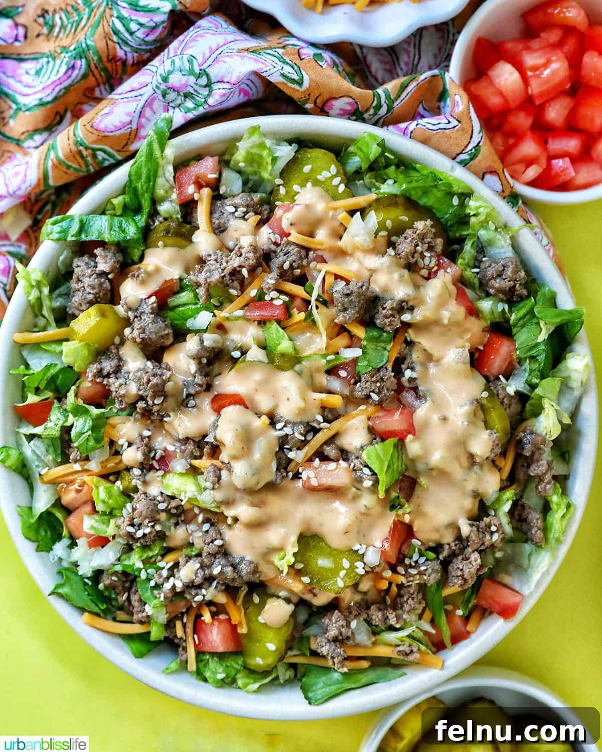 Big Mac Burger Bowl 15 Large bowl of Big Mac salad, with its various toppings and sauce, garnished with sesame seeds.