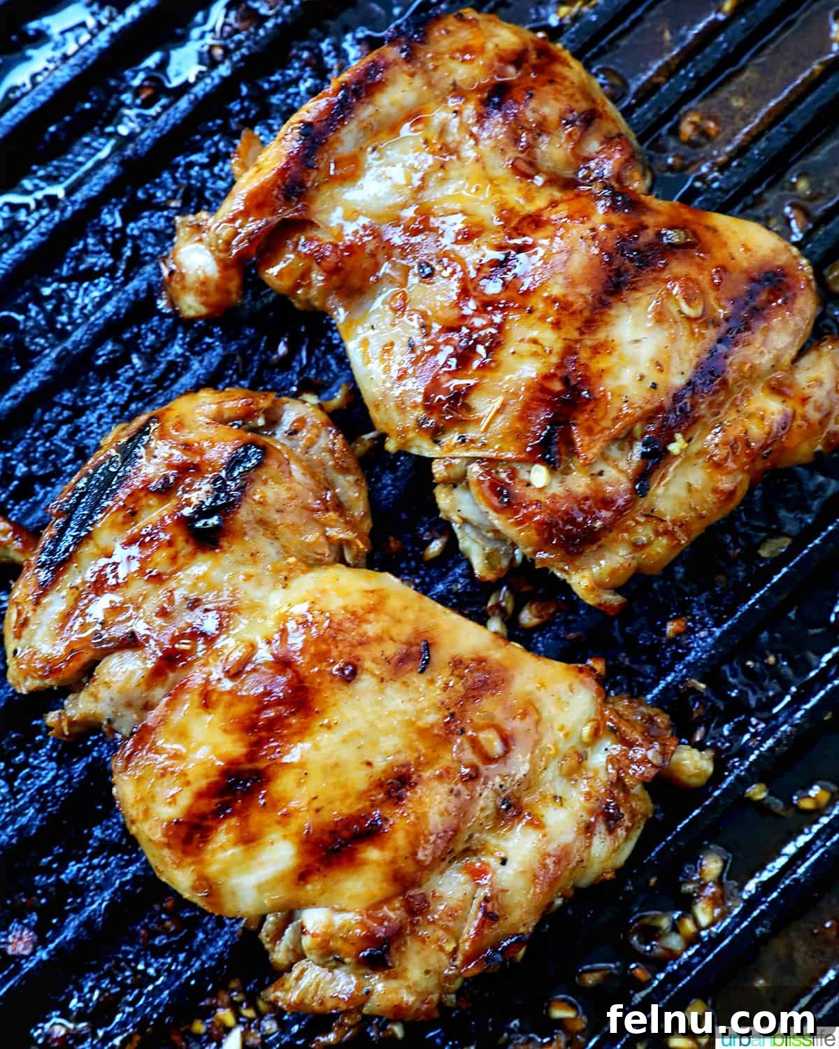 Chicken Inasal 11 Chicken grilling on a grill pan.