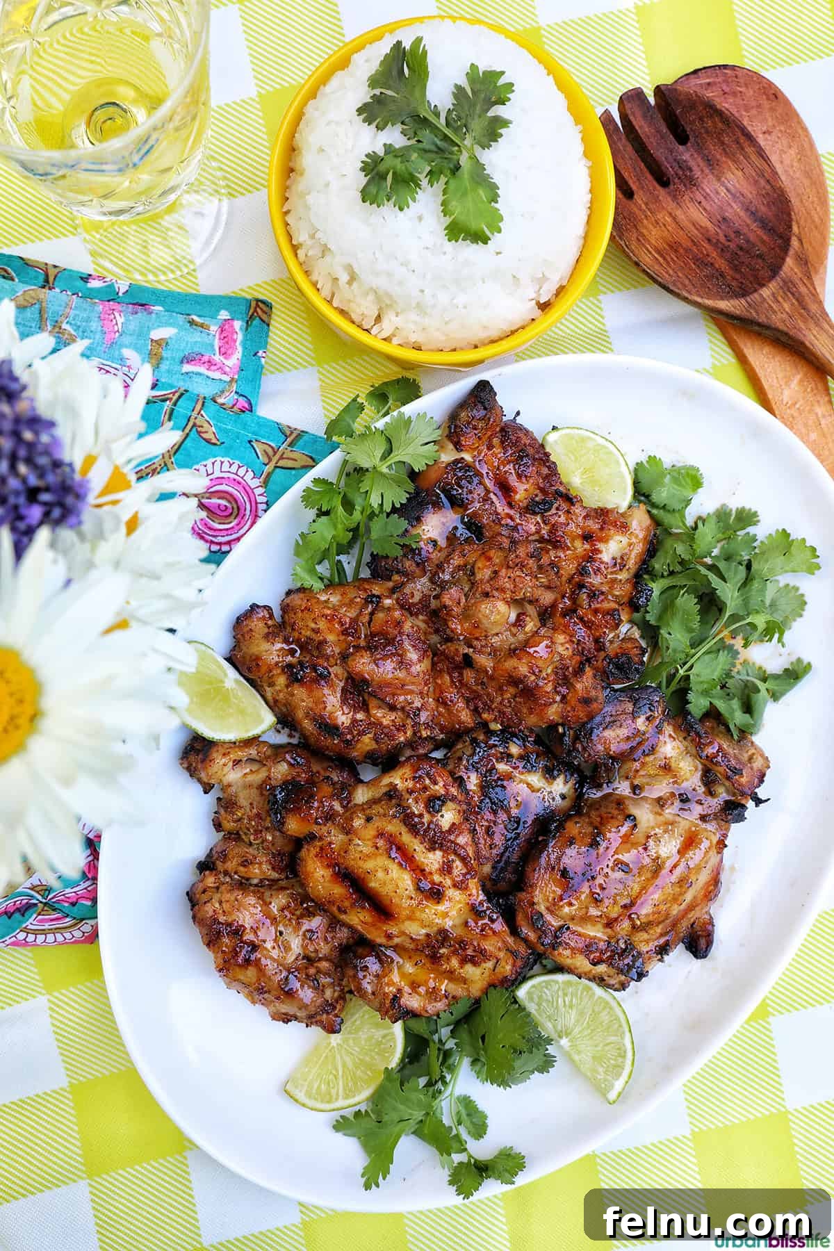 Chicken Inasal 3 Filipino grilled chicken inasal on a platter with rice and daisies.