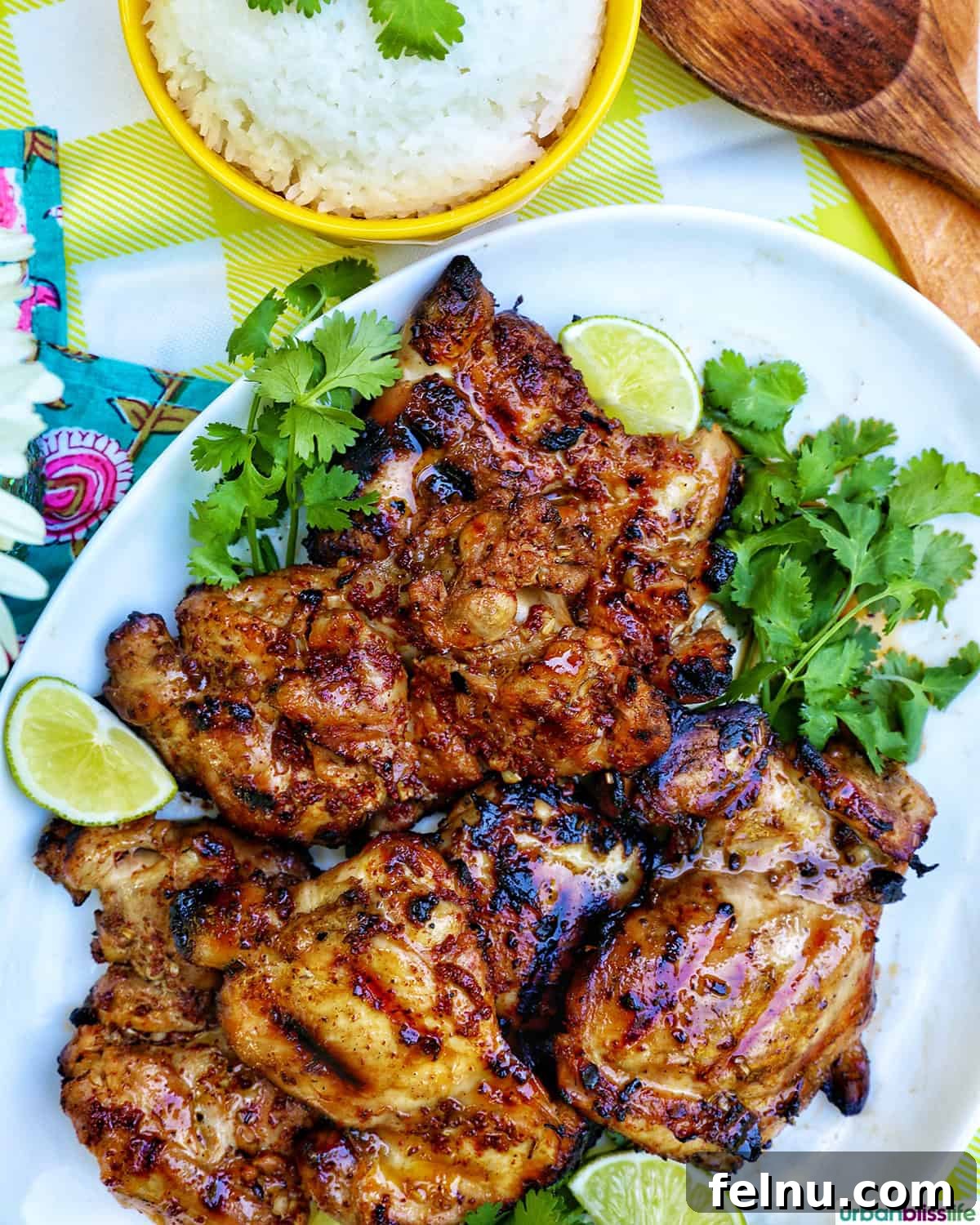Chicken Inasal 4 Filipino grilled chicken inasal plated with a bowl of rice.