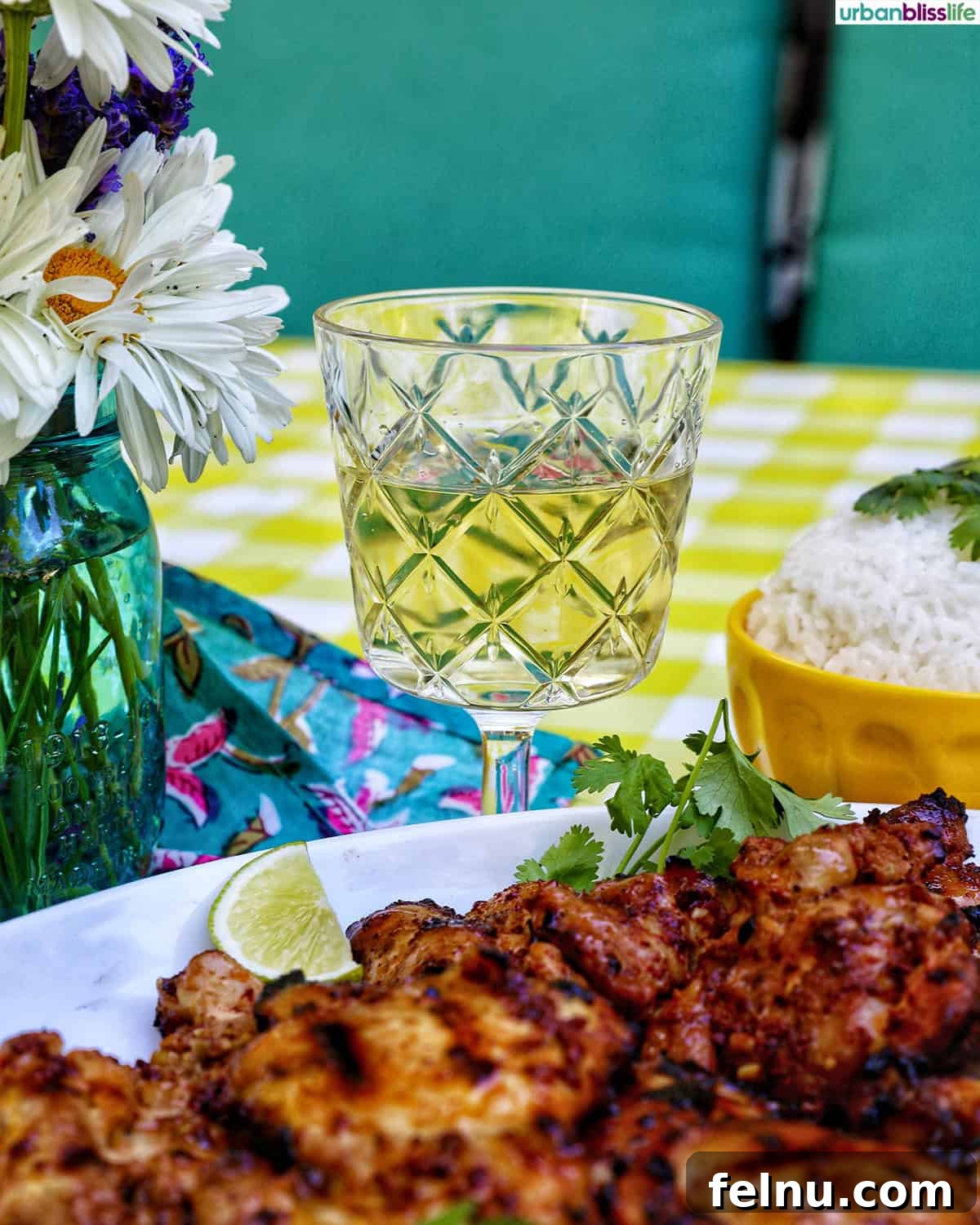 Chicken Inasal 10 Filipino grilled chicken inasal with a glass of white wine.