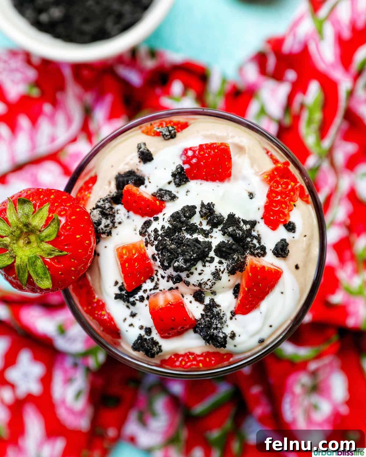 High-Protein Chocolate Dream Parfait 3 High protein chocolate parfait with strawberries and crushed Oreos, top-down view.