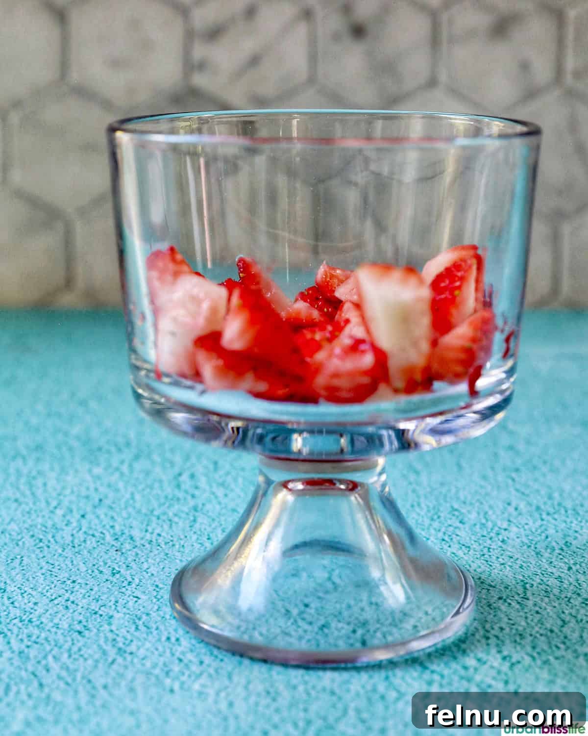 High-Protein Chocolate Dream Parfait 7 Chopped strawberries in a glass bowl, ready for layering.