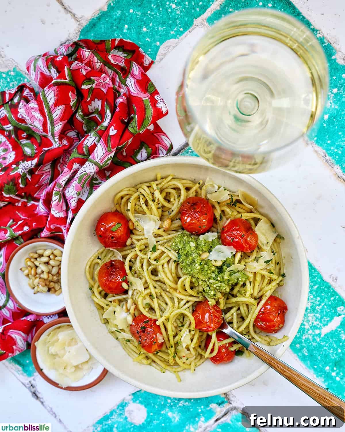 Vibrant Cherry Tomato Pesto Pasta 11 bowl of cherry tomato and pesto pasta with a glass of white wine.