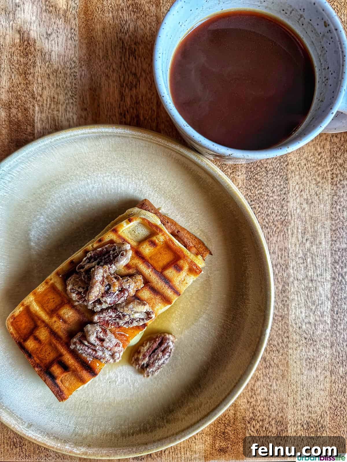 A Taste of Quebec: Culinary Hotspots in the City 4 A steaming cup of coffee alongside a beautifully presented plate of stuffed waffle at Chez Maude in Quebec City.