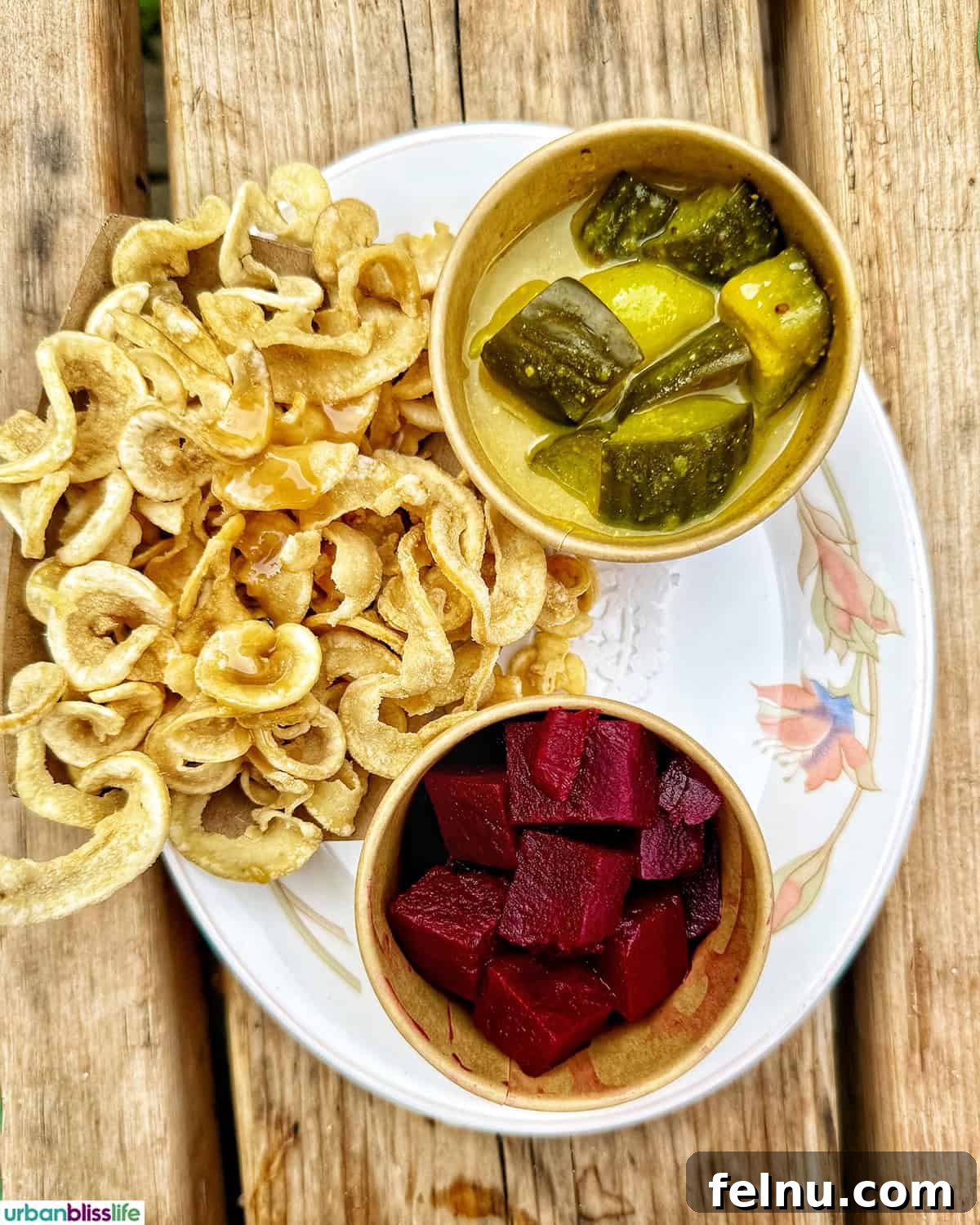 A Taste of Quebec: Culinary Hotspots in the City 8 A plate of crispy Oreilles de Crisse accompanied by pickled vegetables at La Buche restaurant in Quebec City.
