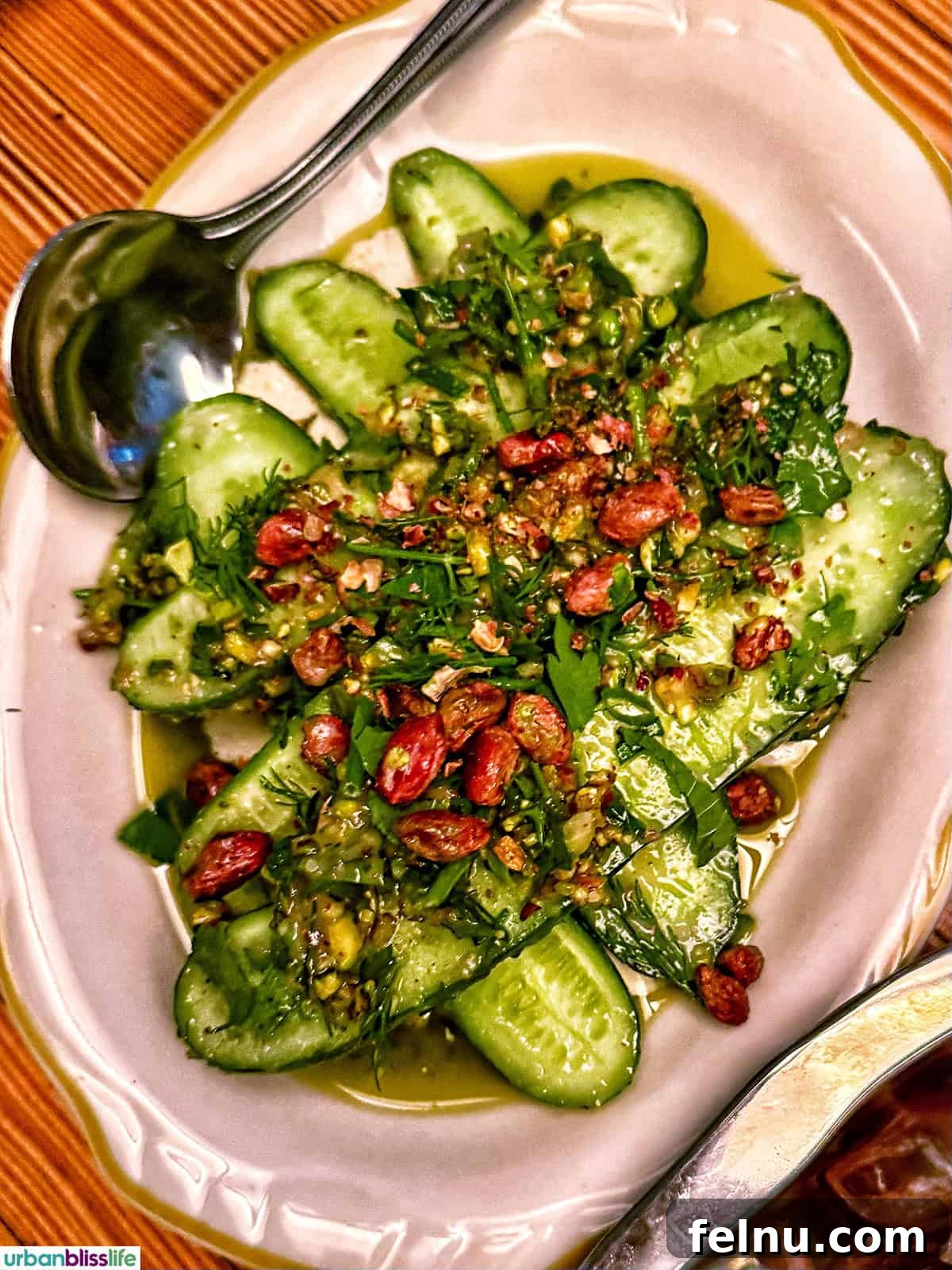 Montreal's Culinary Hotspots 11 A refreshing cucumber salad on a platter at Papito, highlighting the restaurant's commitment to fresh ingredients.