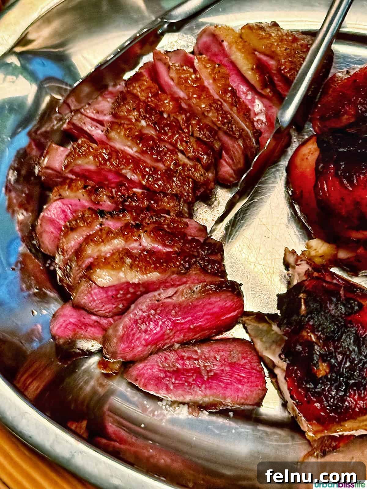 Montreal's Culinary Hotspots 12 Perfectly sliced ribeye steak on a platter at Papito, showcasing the restaurant's expertly grilled meats.