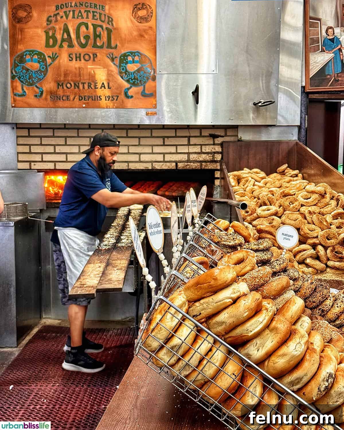 Montreal's Culinary Hotspots 4 Inside the St Viateur bakery, showcasing the woodfire oven and the skilled staff crafting bagels by hand.