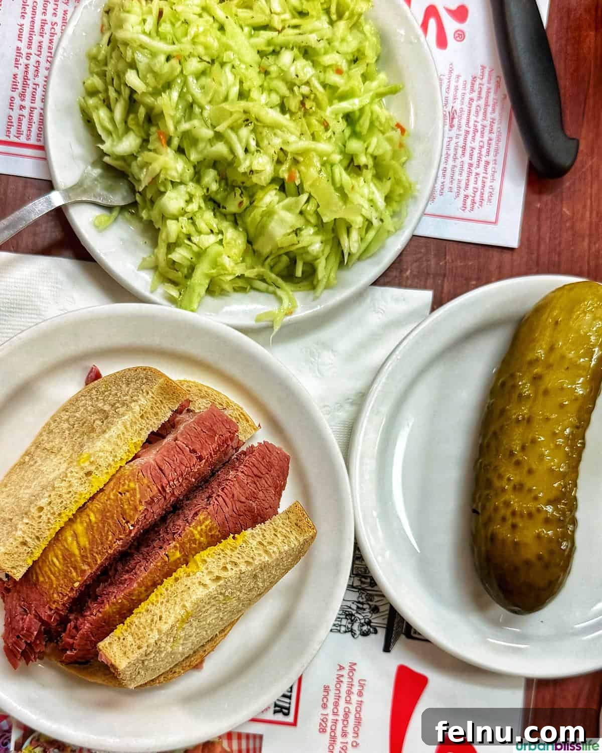 Montreal's Culinary Hotspots 7 A classic Schwartz's deli smoked meat sandwich, accompanied by pickles and coleslaw.