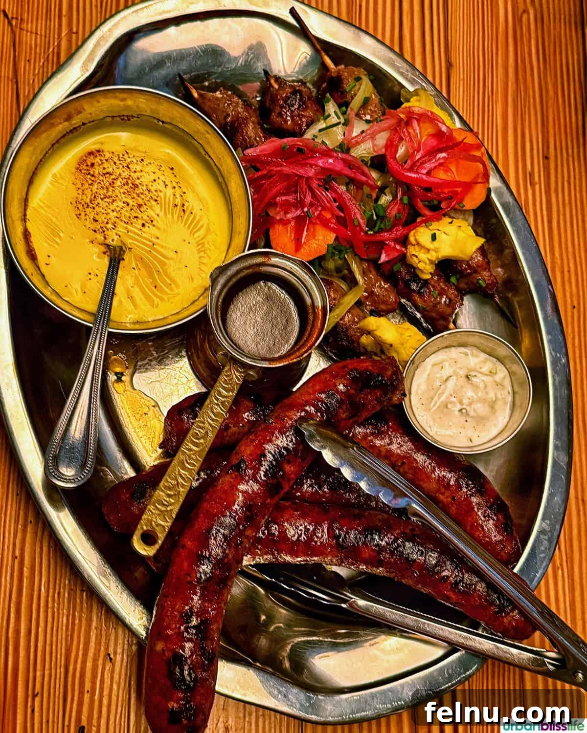 Montreal's Culinary Hotspots 10 A platter of expertly grilled meats and vibrant sauces at Papito, showcasing the restaurant's Latin flair.
