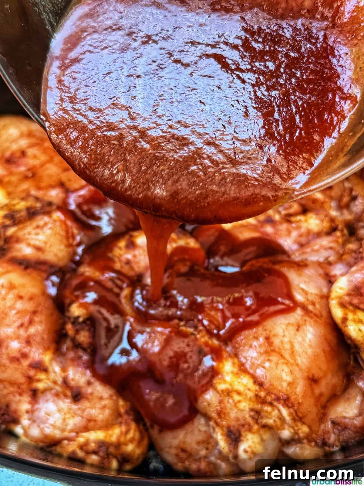 Slow Cooker BBQ Chicken Thighs
Tender & Tangy BBQ Chicken Thighs: Slow Cooker Perfection 10 Pouring barbecue sauce over the chicken