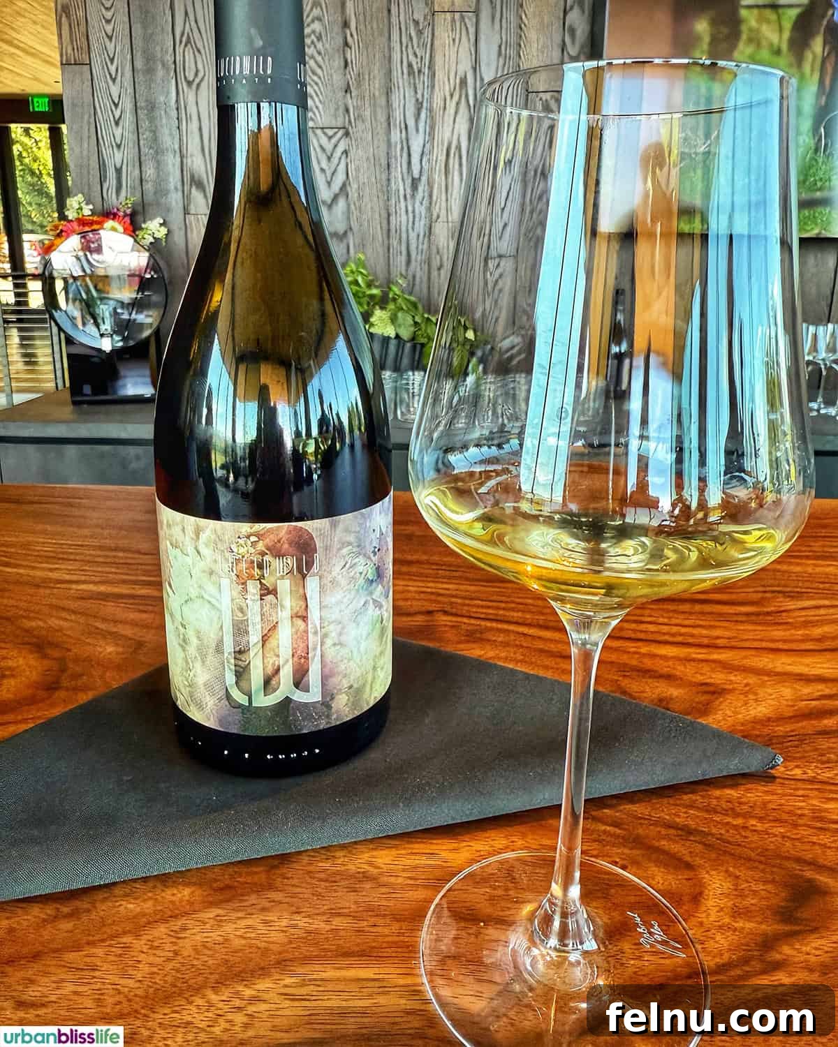 LucidWild Properties 14 Bottle and glass of LucidWild Hidden Chardonnay