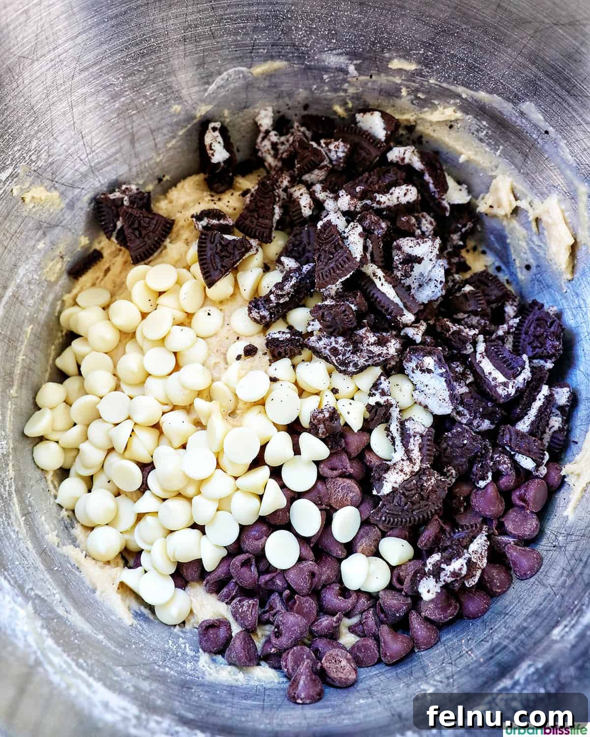 Cookies and Cream Protein Delight 11 Adding chocolate chips and Oreo cookies to the batter
