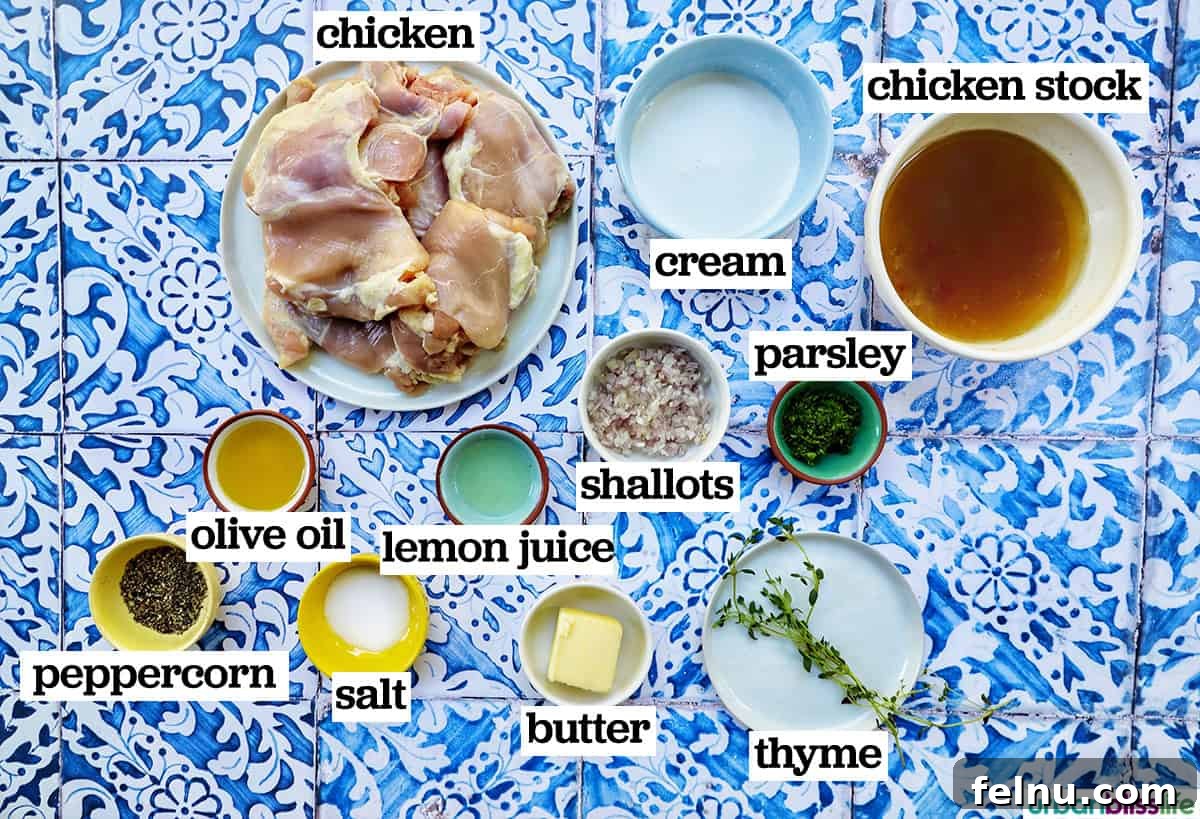 Rich Brandy Peppercorn Chicken 5 A vibrant flat lay of fresh ingredients laid out for making Chicken au Poivre, including chicken thighs, peppercorns, butter, shallots, and herbs.