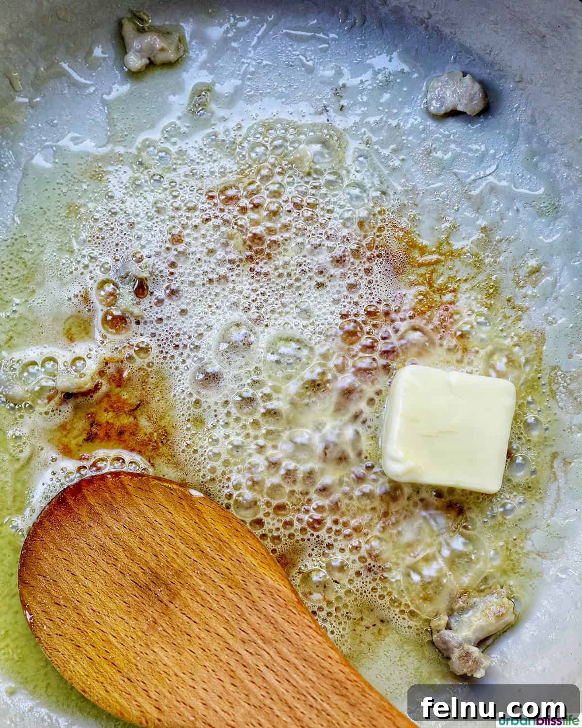 Rich Brandy Peppercorn Chicken 9 Unsalted butter melting in the hot skillet, ready for aromatics.
