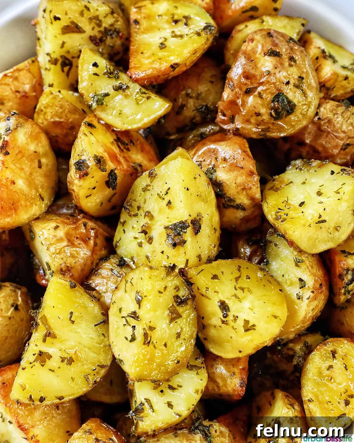 Herb-Infused Potato Delights 3 Close-up of herby potatoes revealing their crispy texture.