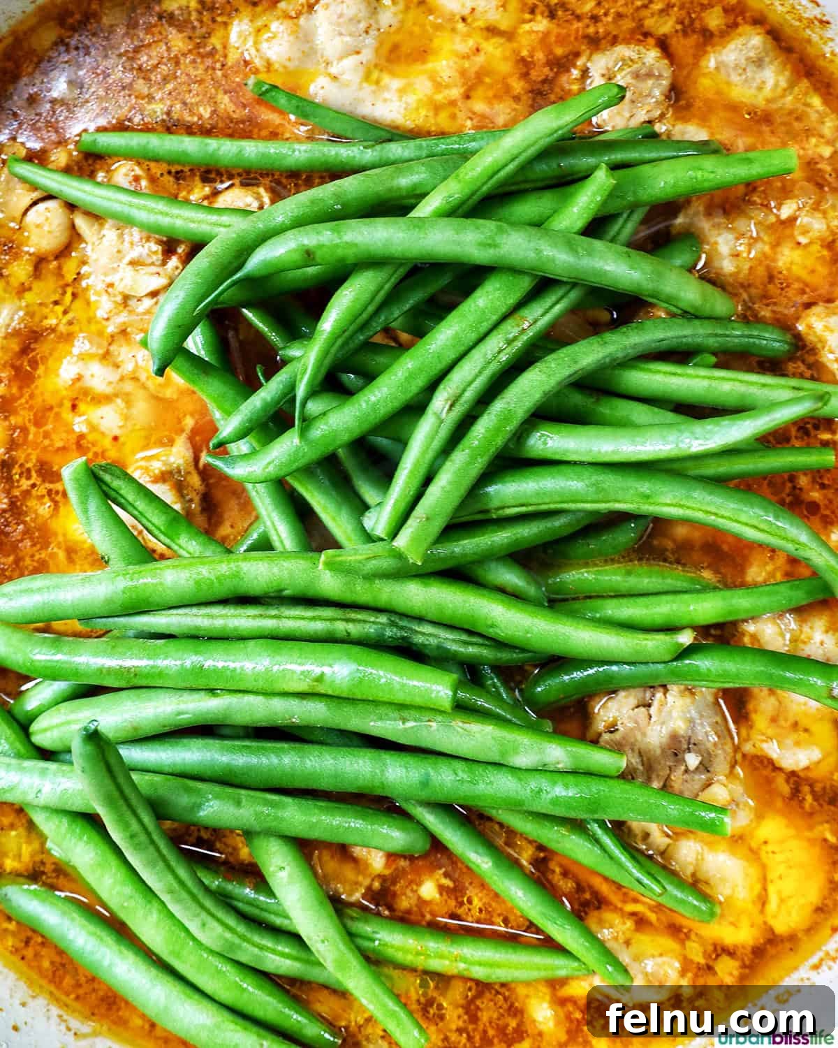 Rich Filipino Peanut Chicken 15 Fresh green beans added to the chicken kare kare, ready to cook.