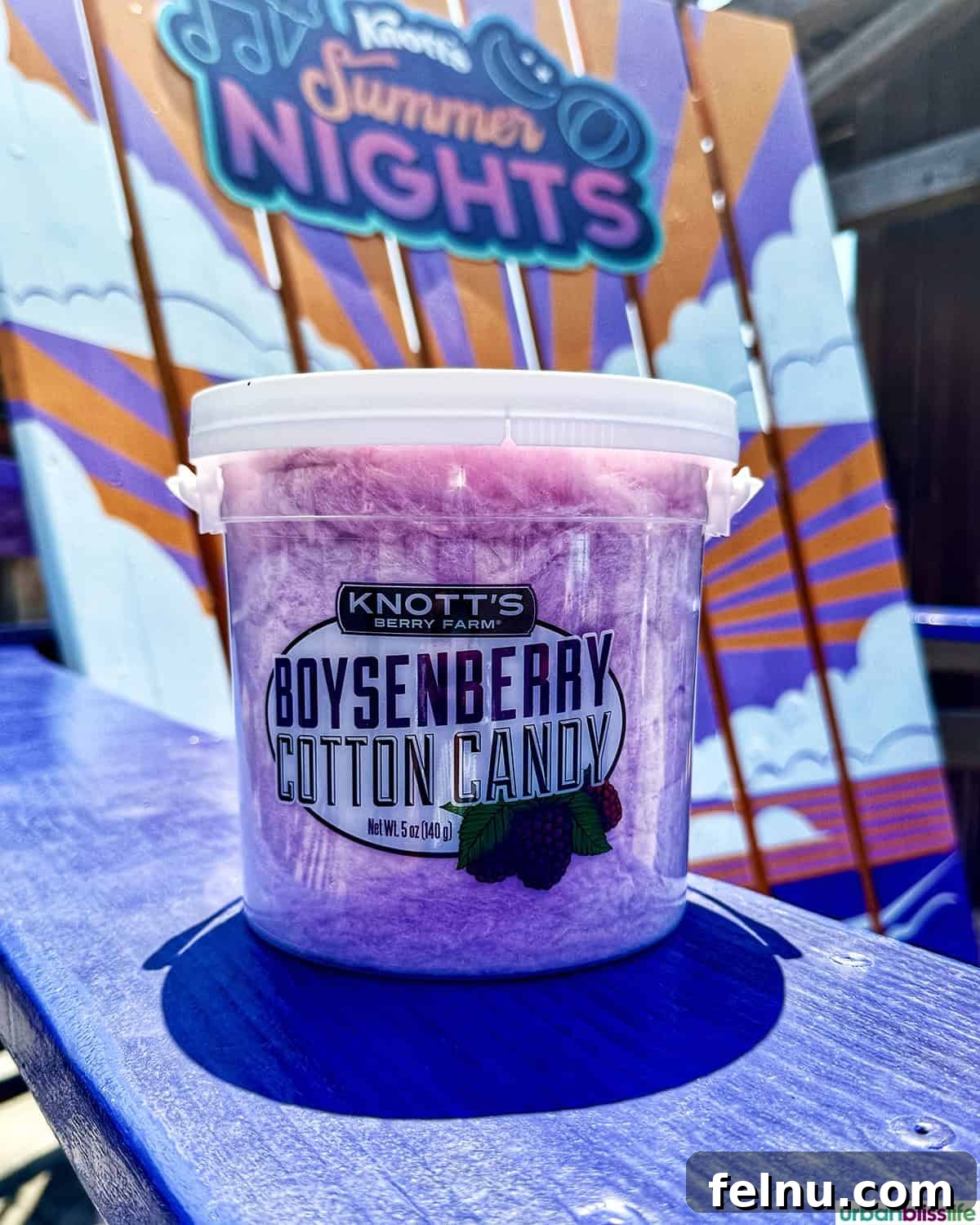 Boysenberry Bliss: A Food Lover's Journey Through Knott's Berry Farm 6 A tub of vibrant Boysenberry cotton candy