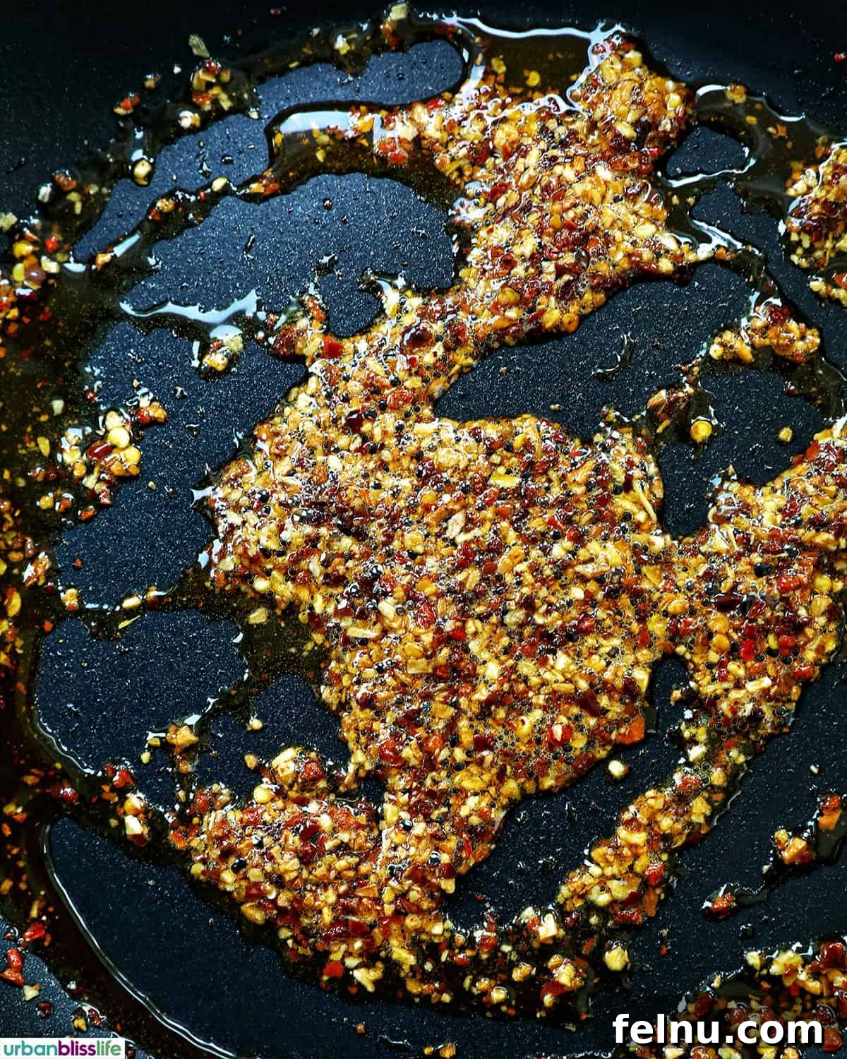 Golden Yolks, Fiery Crunch 7 Fresh eggs cracked directly into the heated chili crisp and oil mixture in the pan.