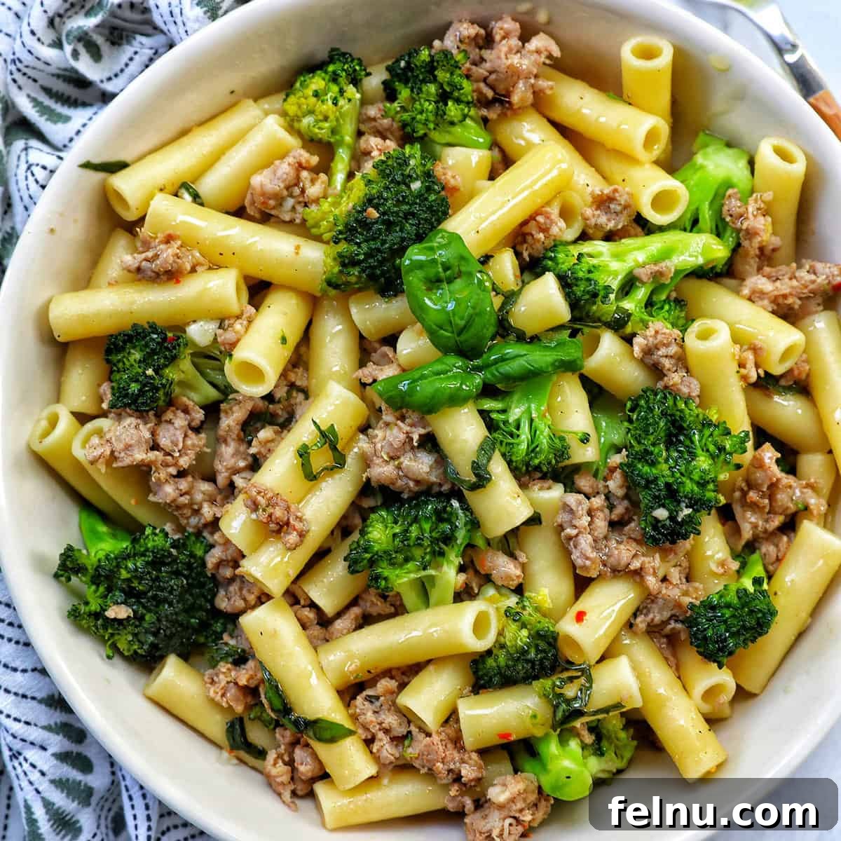 A robust and wholesome pasta dish combining savory Italian sausage with healthy broccoli florets.