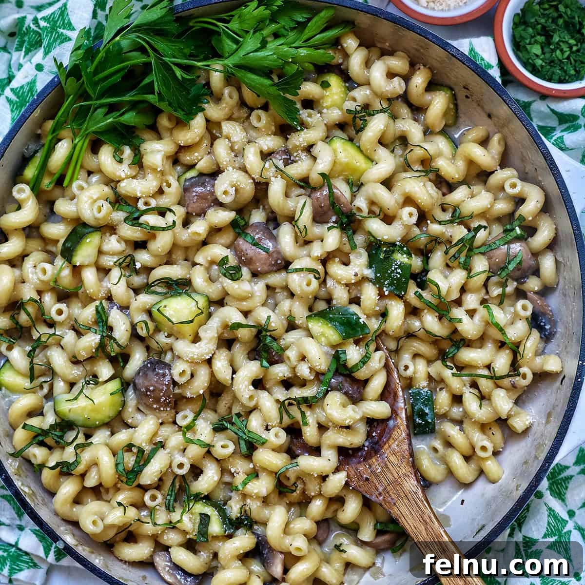 A light and fresh pasta dish showcasing seasonal zucchini and savory mushrooms.