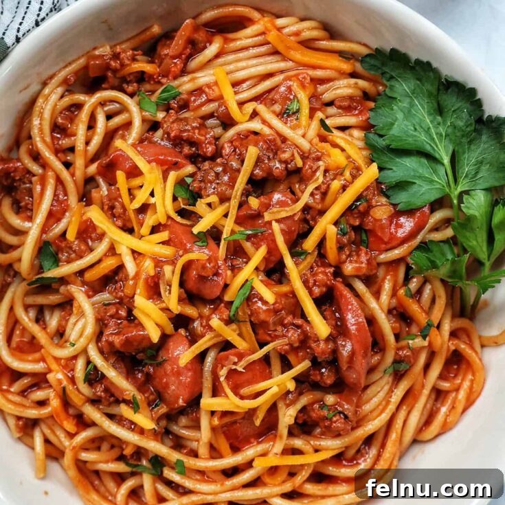 Experience a unique sweet and savory spaghetti with hot dogs and ground meat, inspired by the popular Filipino fast-food chain.