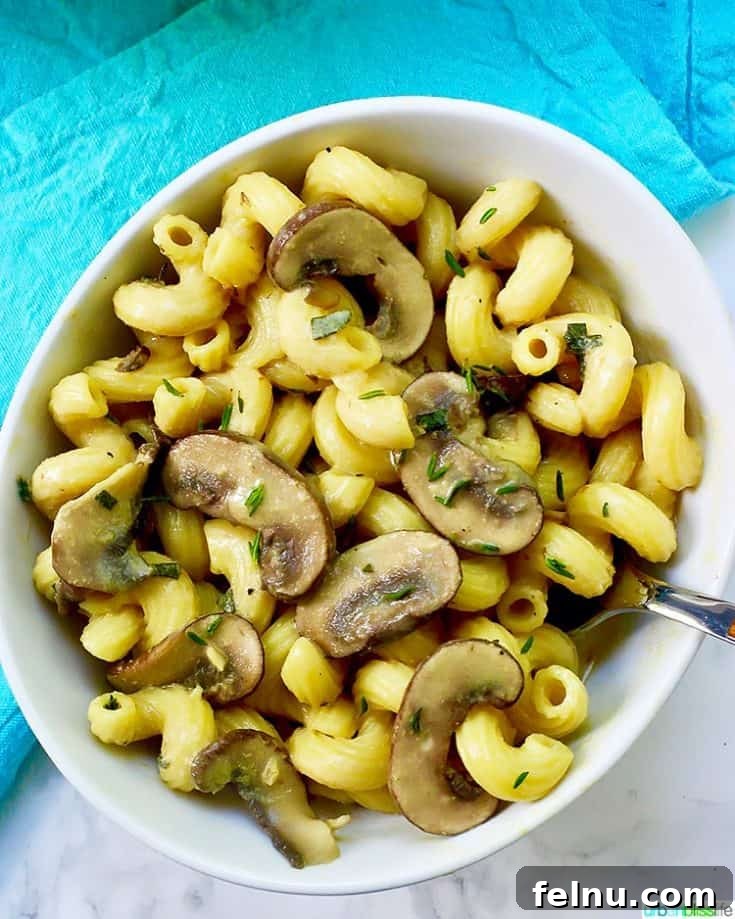 Earthy mushrooms take center stage in this rich and creamy vegan pasta, a comforting and flavorful dish for any night.