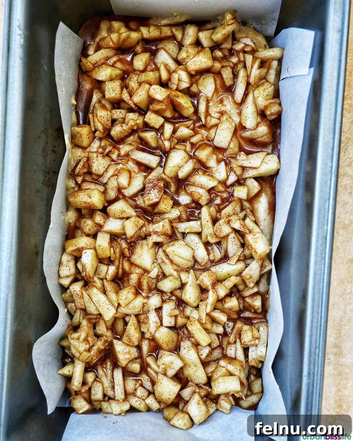 Apple Cinnamon Swirl Bread 16 Layer of apples in baking tin.