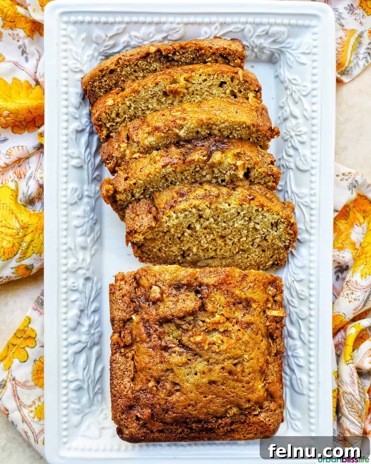 Apple Cinnamon Swirl Bread 18 Sliced apple cinnamon loaf on a platter.