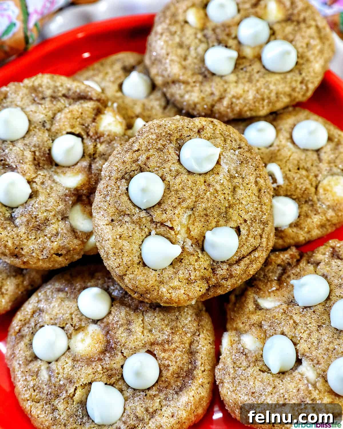 Pumpkin White Chocolate Chip Delights 17 Stack of pumpkin white chocolate chip cookies on an orange plate