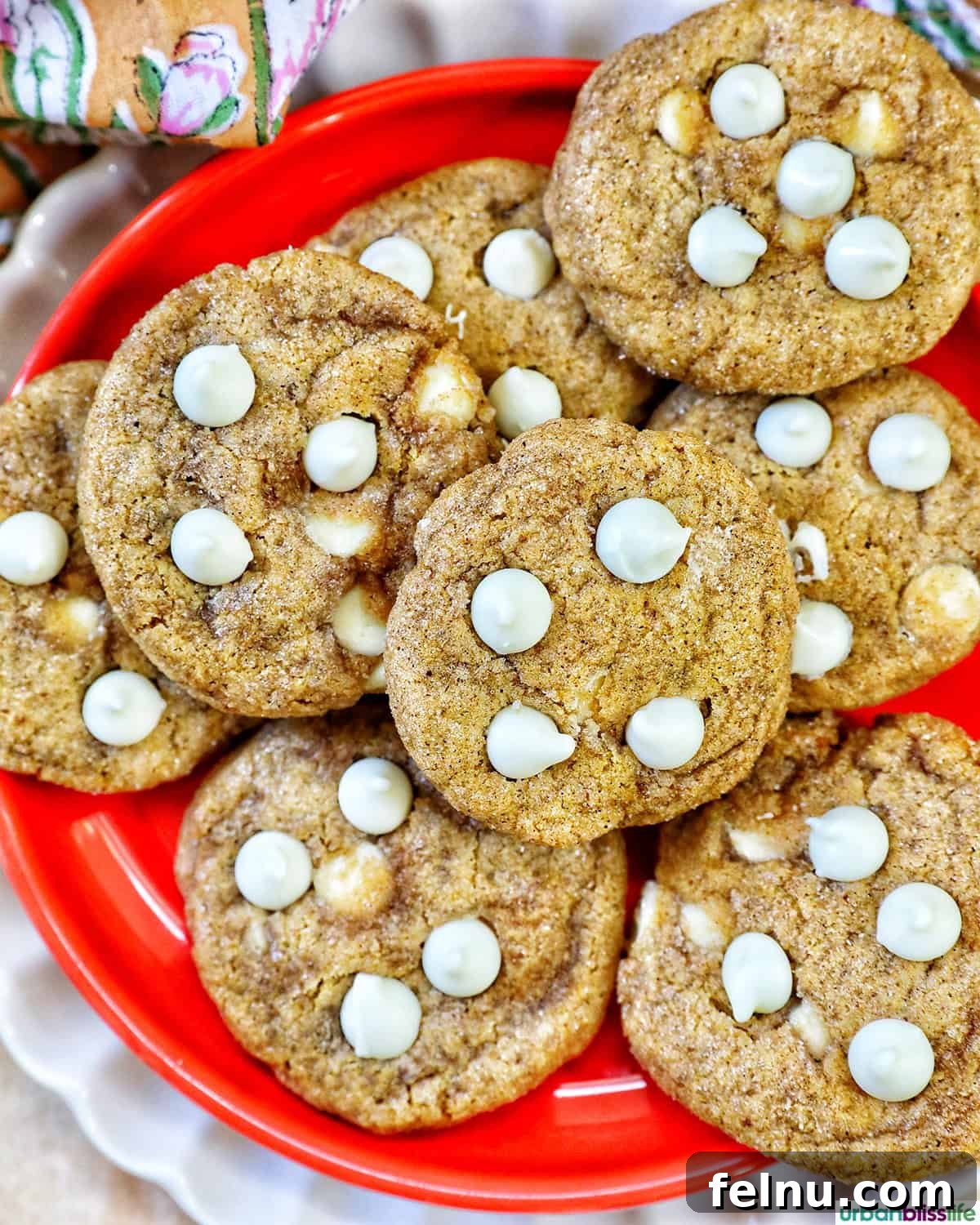 Pumpkin White Chocolate Chip Delights 3 Close-up of pumpkin white chocolate chip cookies on an orange plate