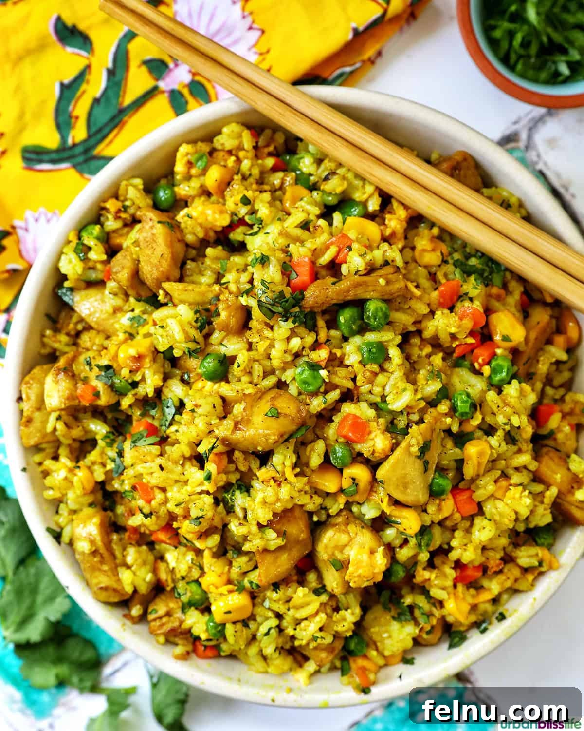 Curried Chicken Fried Rice 2 Curry Chicken Fried Rice served with chopsticks.