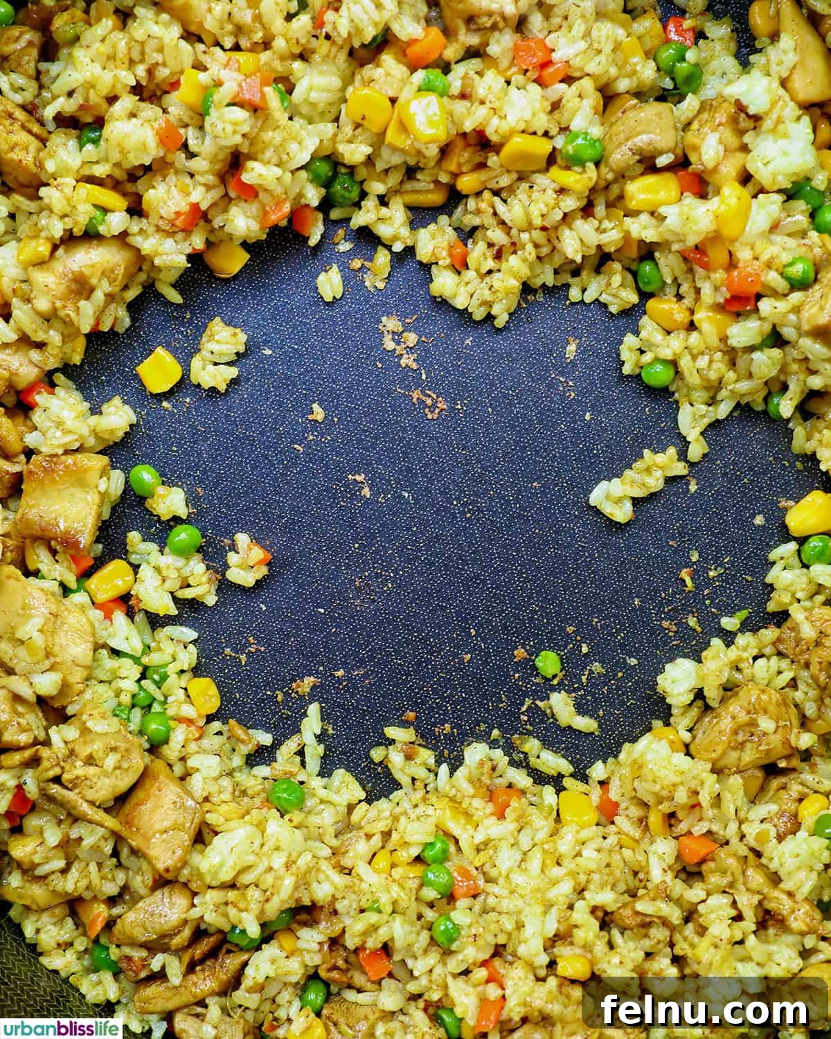 Curried Chicken Fried Rice 11 Creating a well in the center of the rice.