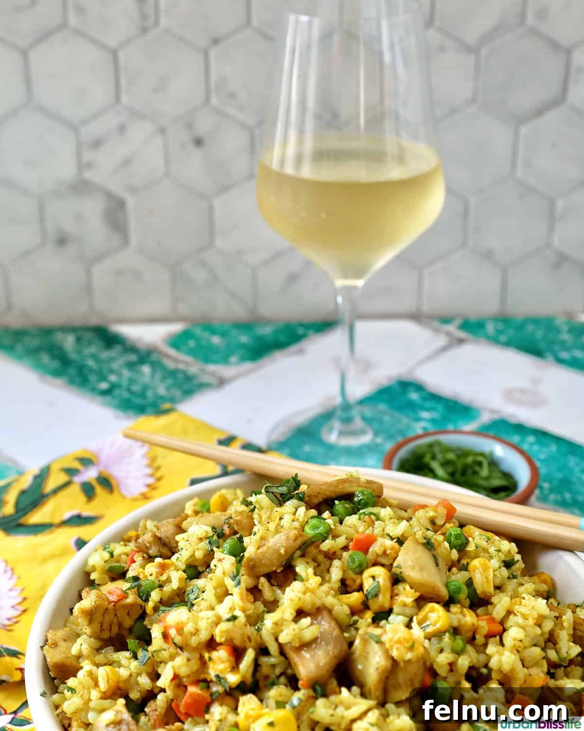 Curried Chicken Fried Rice 15 Curry Chicken Fried Rice with a glass of white wine.