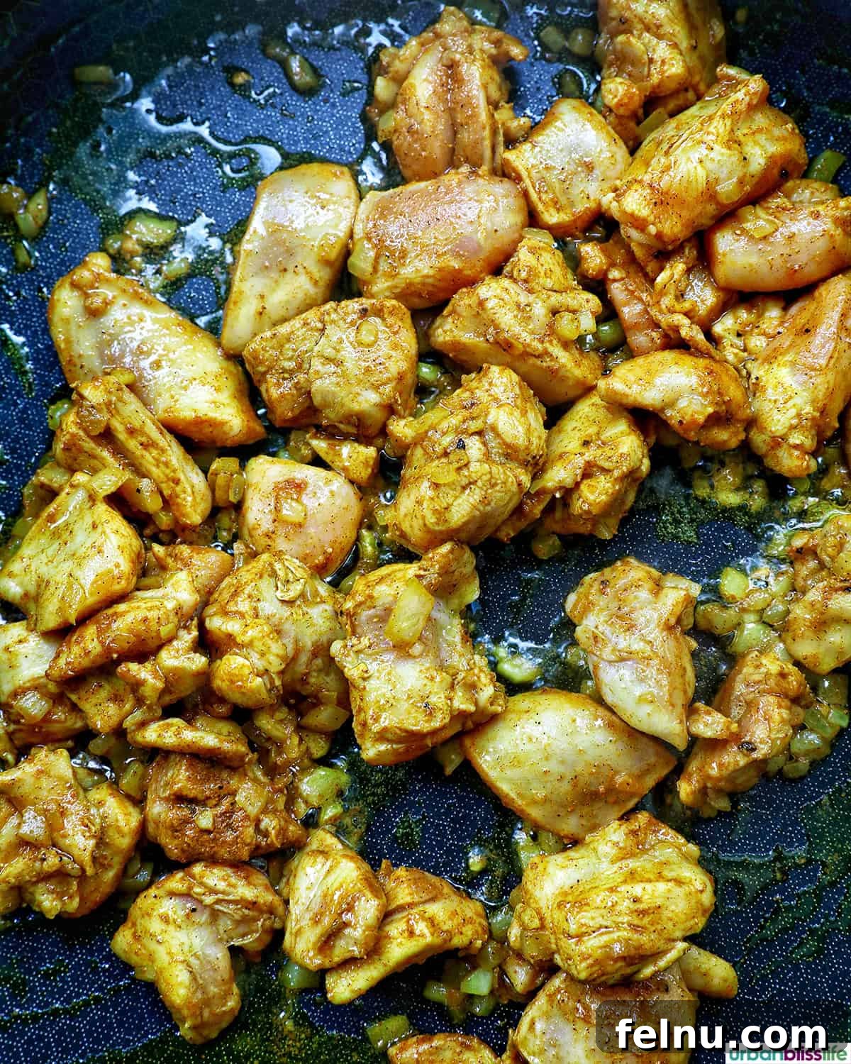 Curried Chicken Fried Rice 7 Cooking chicken in the pan.