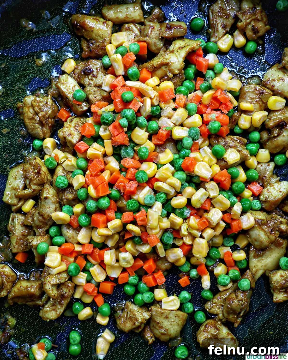 Curried Chicken Fried Rice 8 Cooking mixed vegetables with chicken.