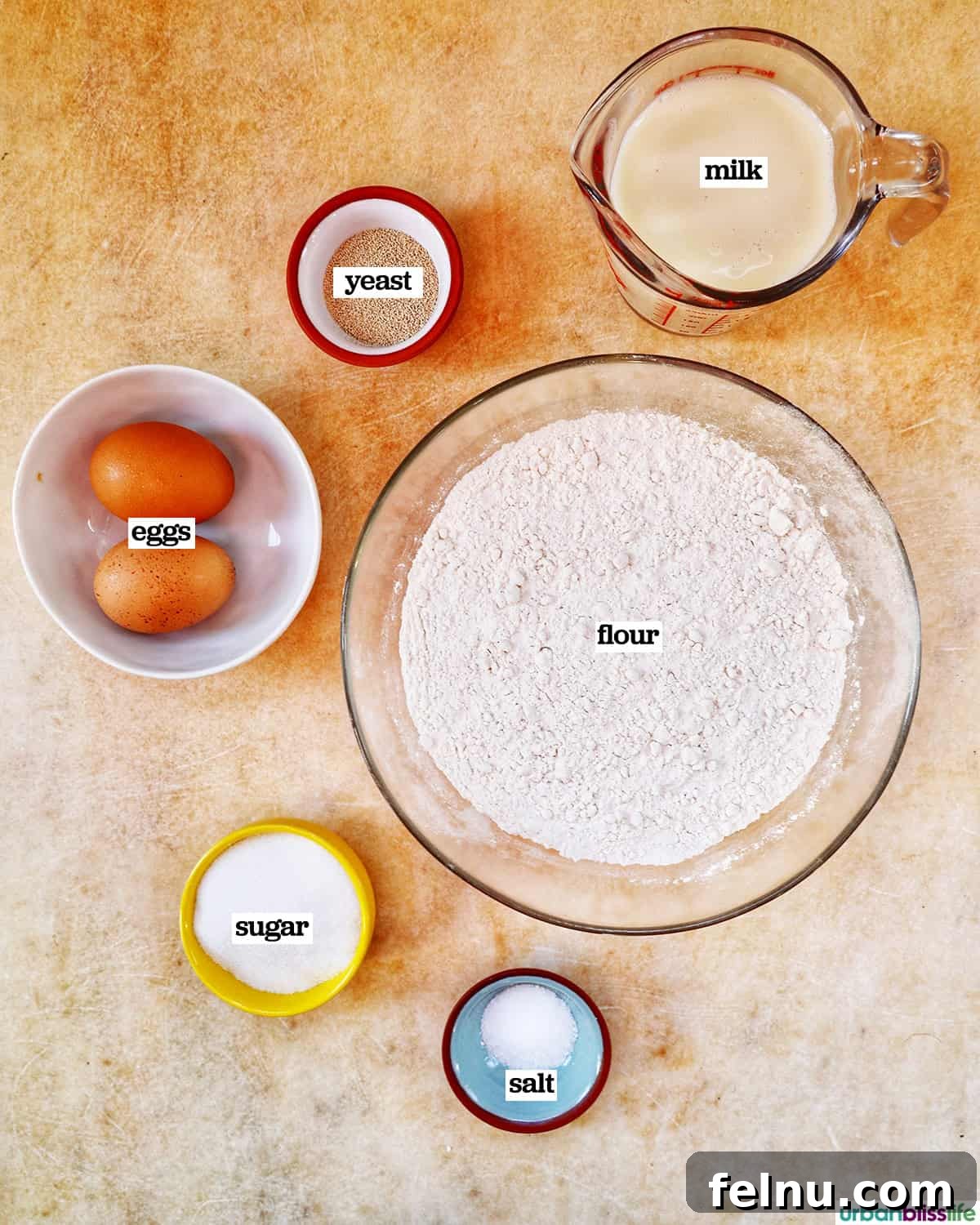 Ingredients for making sweet cinnamon roll dough.