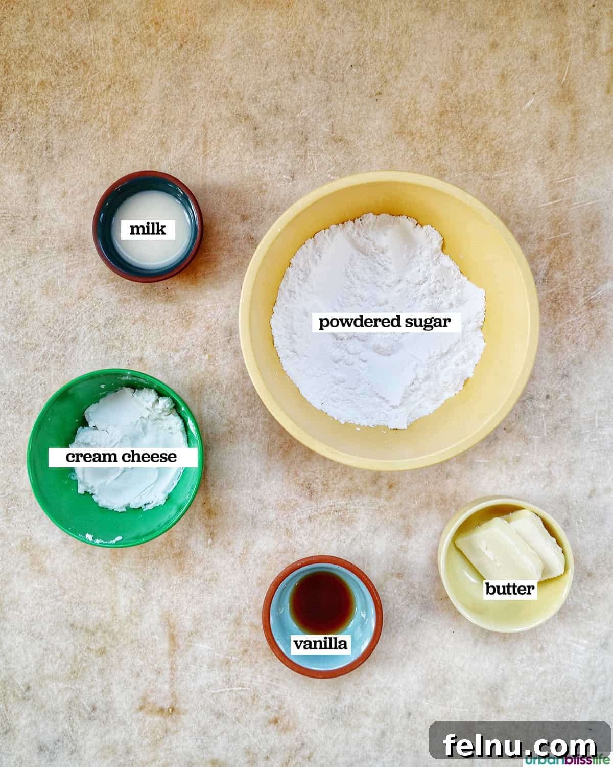 Ingredients for creamy cream cheese frosting.
