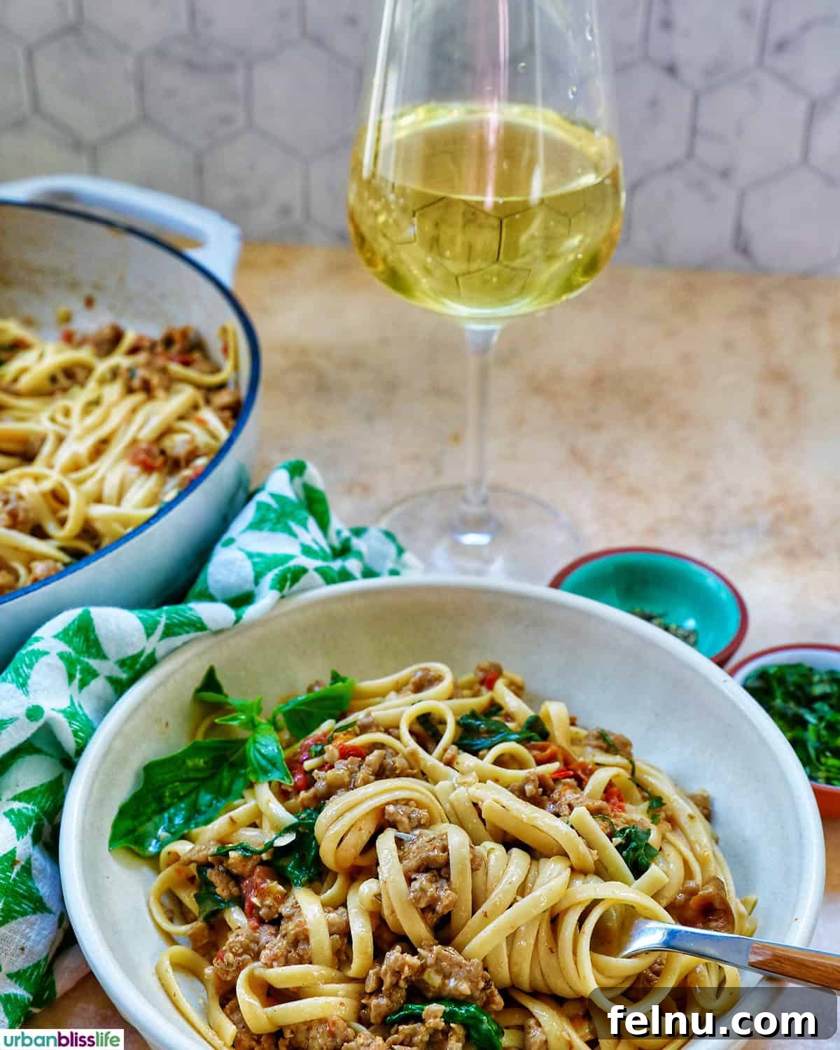 Tuscan Sausage Pasta Delight 21 Bowl of Tuscan Sausage Pasta with wine