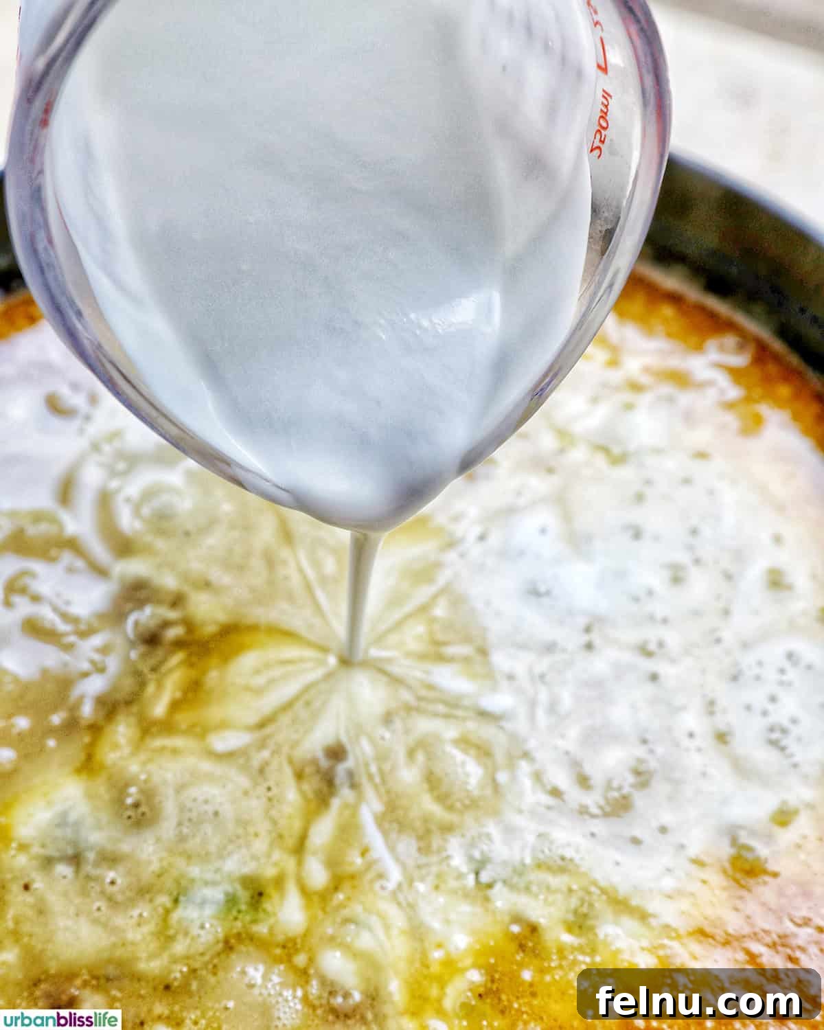 Smoky Sausage and Sweet Corn Chowder 12 Heavy cream and corn being poured into the simmering chowder.