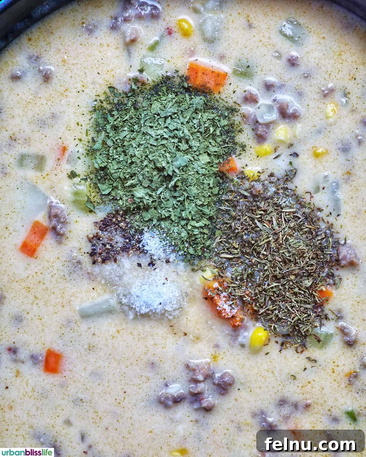 Smoky Sausage and Sweet Corn Chowder 13 Fresh herbs like parsley and green onions being sprinkled over the finished chowder.