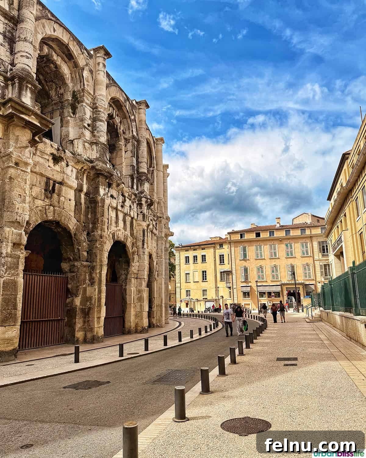Montpellier Magic: Your Guide to a French Gem 24 Panoramic view of the Nîmes amphitheater from outside, integrating with the modern cityscape.