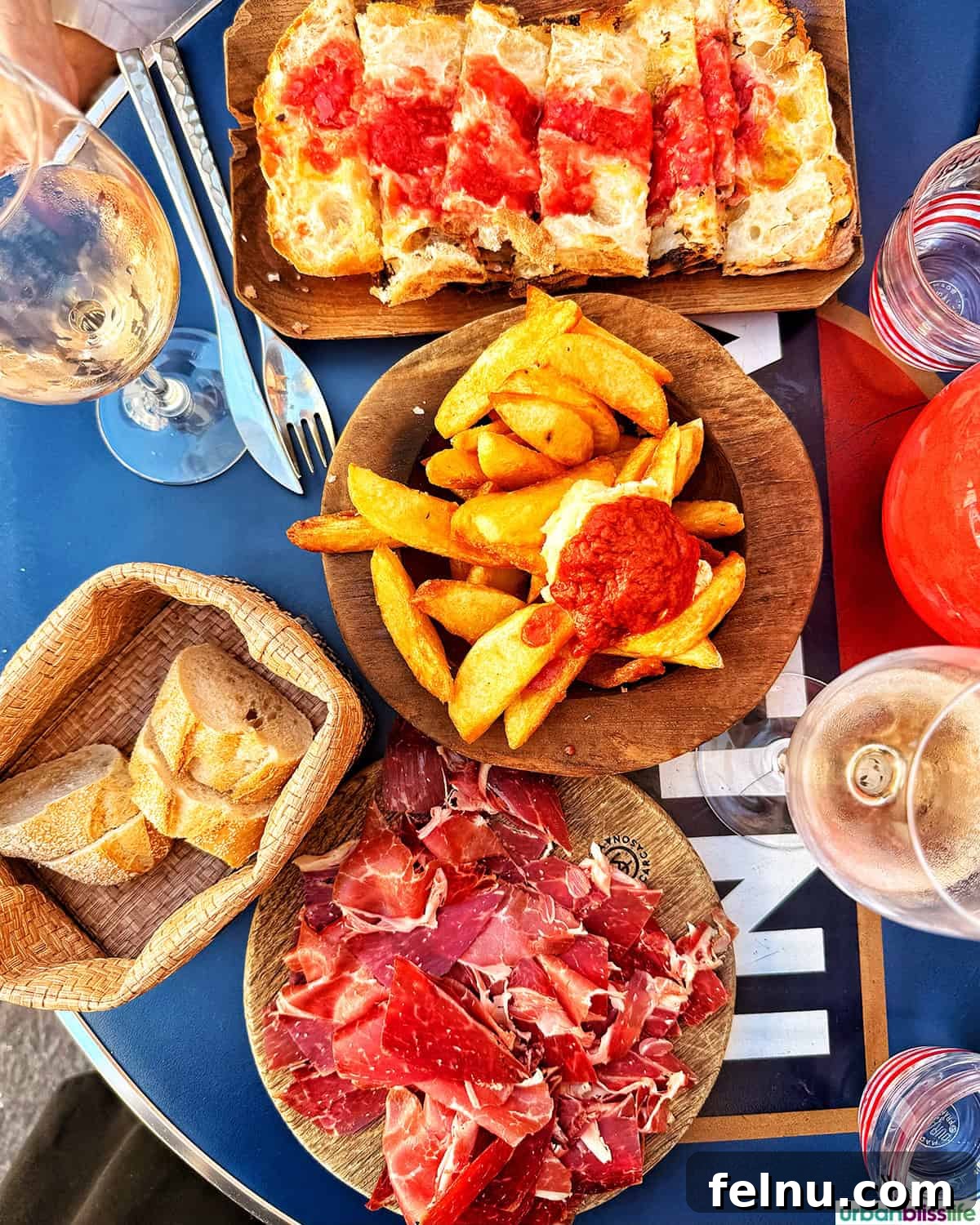 Montpellier Magic: Your Guide to a French Gem 33 Delicious Iberico ham, pan tumaca, and patatas bravas at Casa Maria in Carcassonne, France, a perfect Spanish-inspired meal.