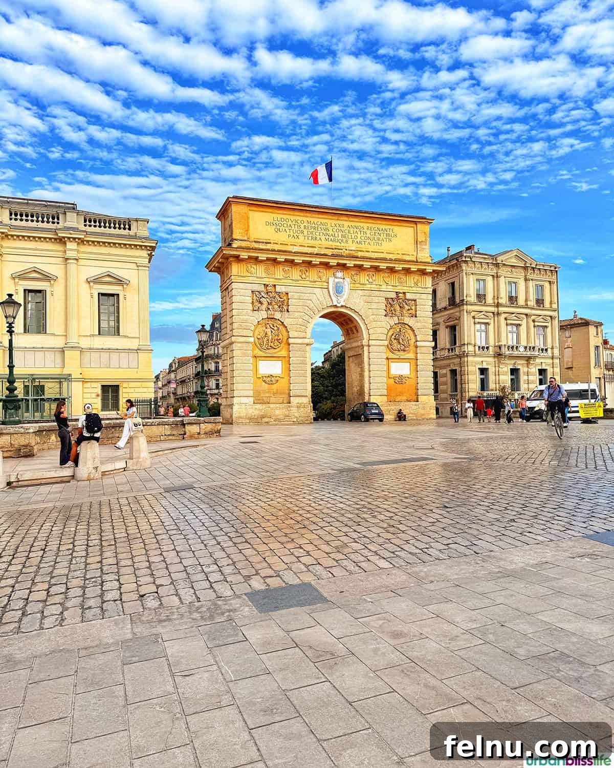 Montpellier Magic: Your Guide to a French Gem 7 The majestic Arc de Triomphe in Montpellier, France, glowing golden in the late afternoon sun.