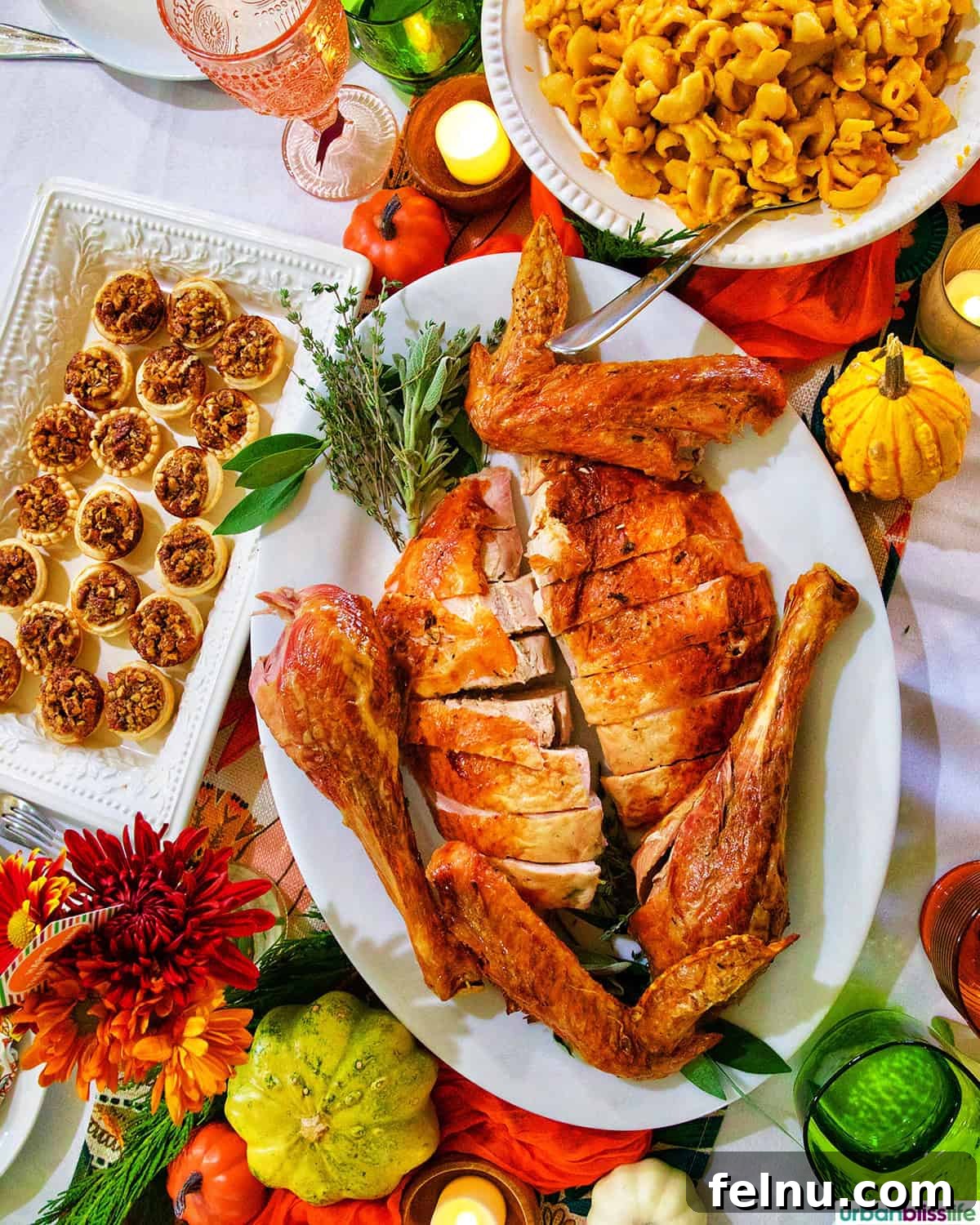 Friendsgiving Feast: A Celebration of Gratitude and Good Food 2 A beautifully set Friendsgiving table featuring a Thanksgiving turkey, mini pecan pies, and butternut squash mac and cheese.