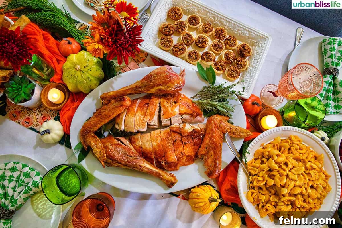 Friendsgiving Feast: A Celebration of Gratitude and Good Food 3 A beautifully arranged Friendsgiving Thanksgiving turkey on a table with mini pecan pies and butternut squash mac and cheese.
