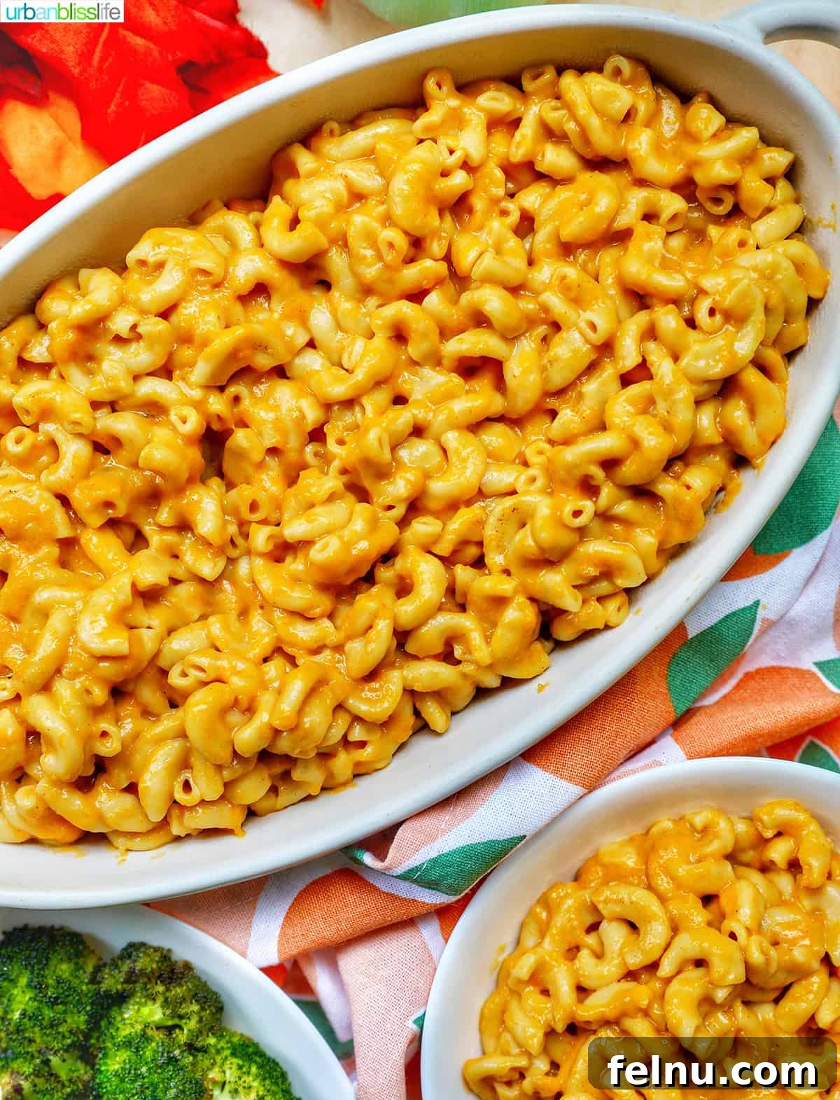 Friendsgiving Feast: A Celebration of Gratitude and Good Food 7 A platter of creamy and delicious Butternut Squash Mac and Cheese, a vegan-friendly Friendsgiving option.