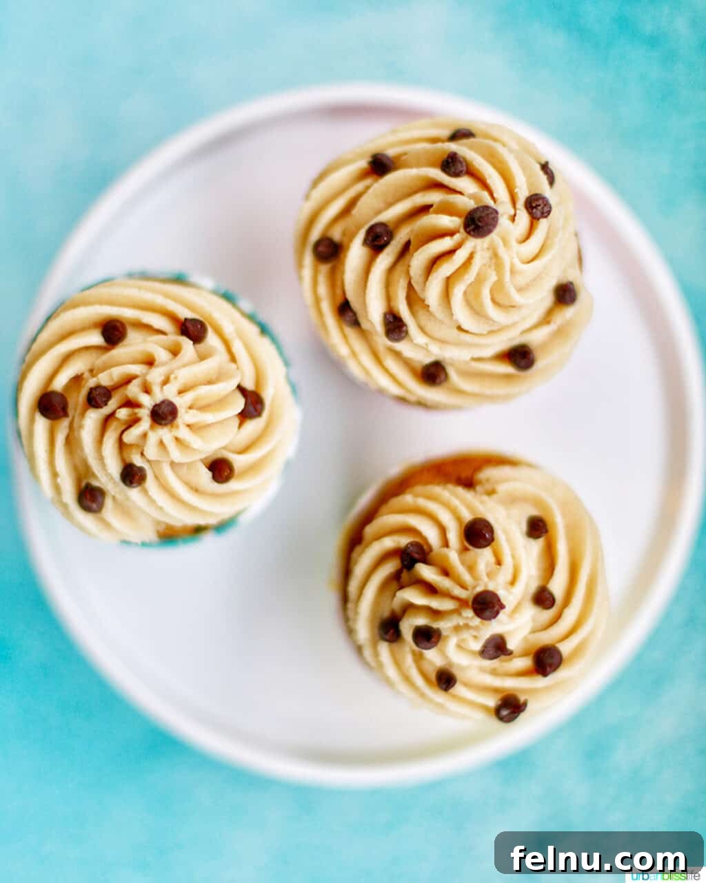 Chocolate Chip Cookie Dough Dream Cupcakes 6 Three cupcakes looking down at the cookie dough frosting tops with chocolate chips